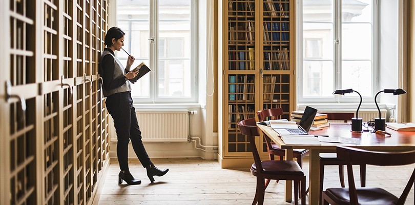 Woman working alone in a library