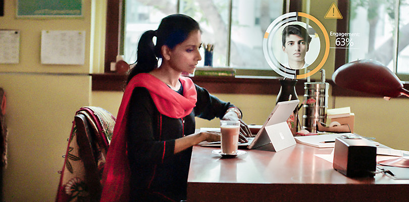 Photography depicts Microsoft AI technology that predicts probability of a student dropping out of school to proactive assist educators.