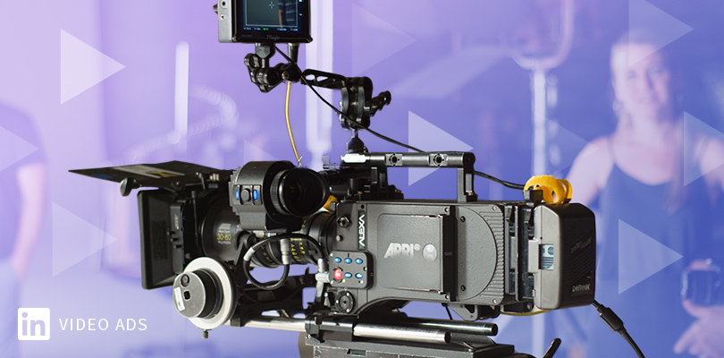 video camera on purple background