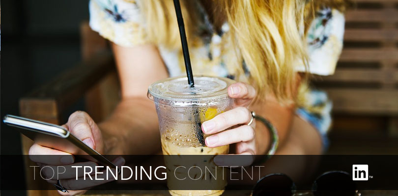 Girl on phone drinking coffee