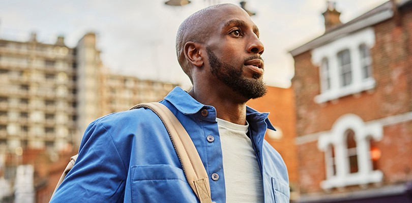 Closeup of man walking down street