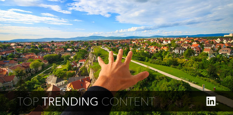 Hand Reaching Out to Large Scenic Landscape