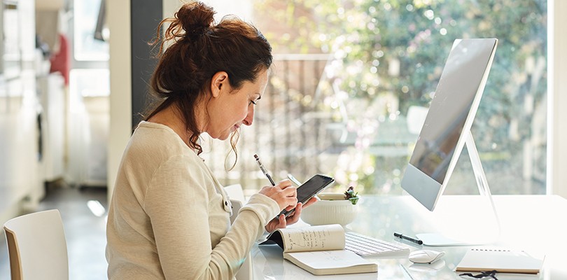 Woman working alone at a desk remotely