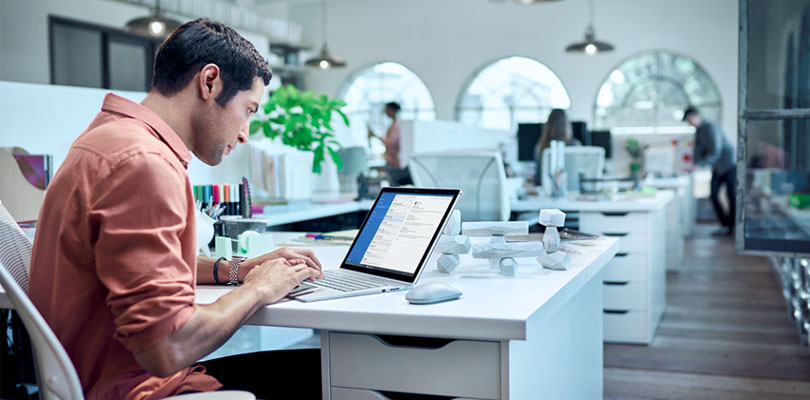 Man working on Microsoft Surface
