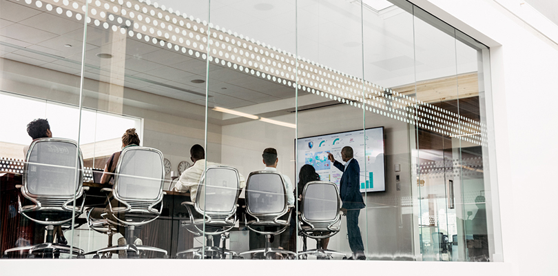 five members of the buying circle listen to a marketer pitch