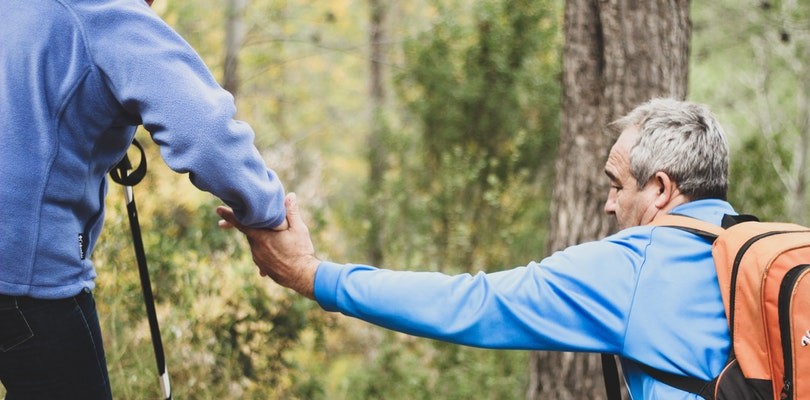 One Man Helping Another on Hike