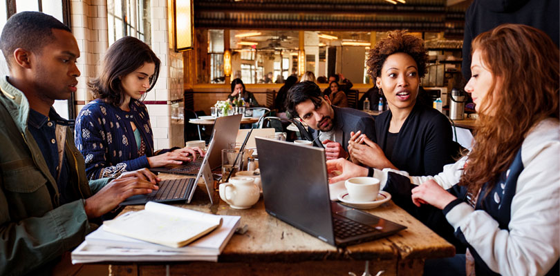 Young people working in cafe