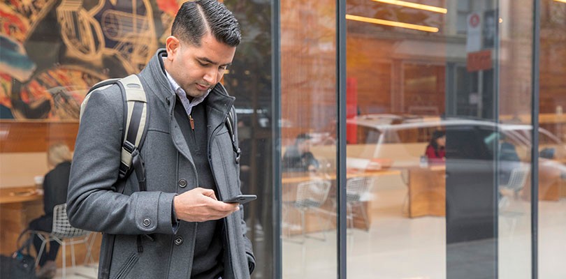 LinkedIn employee looking at phone