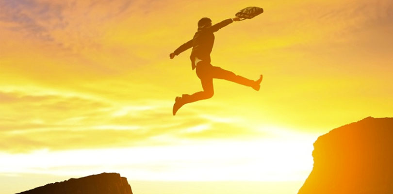 Man in suit jumping