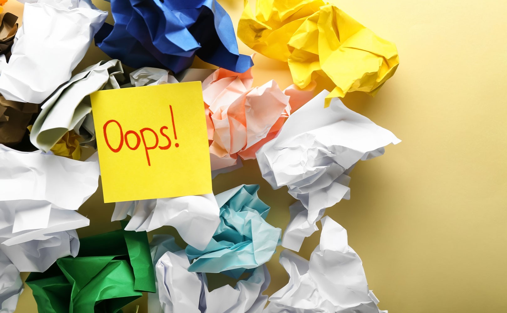 Photo of crumpled up post-it notes, plus one uncrumpled one that says "oops"