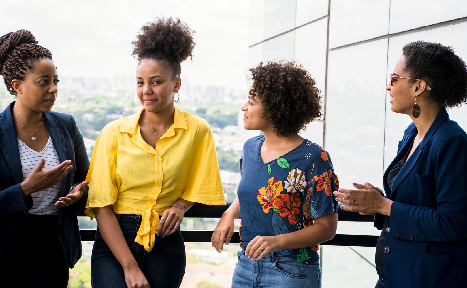 Photograph of 4 women talking outside