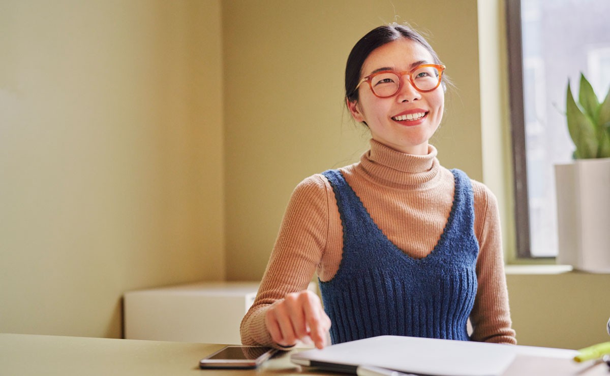 Photo of smiling woman at work