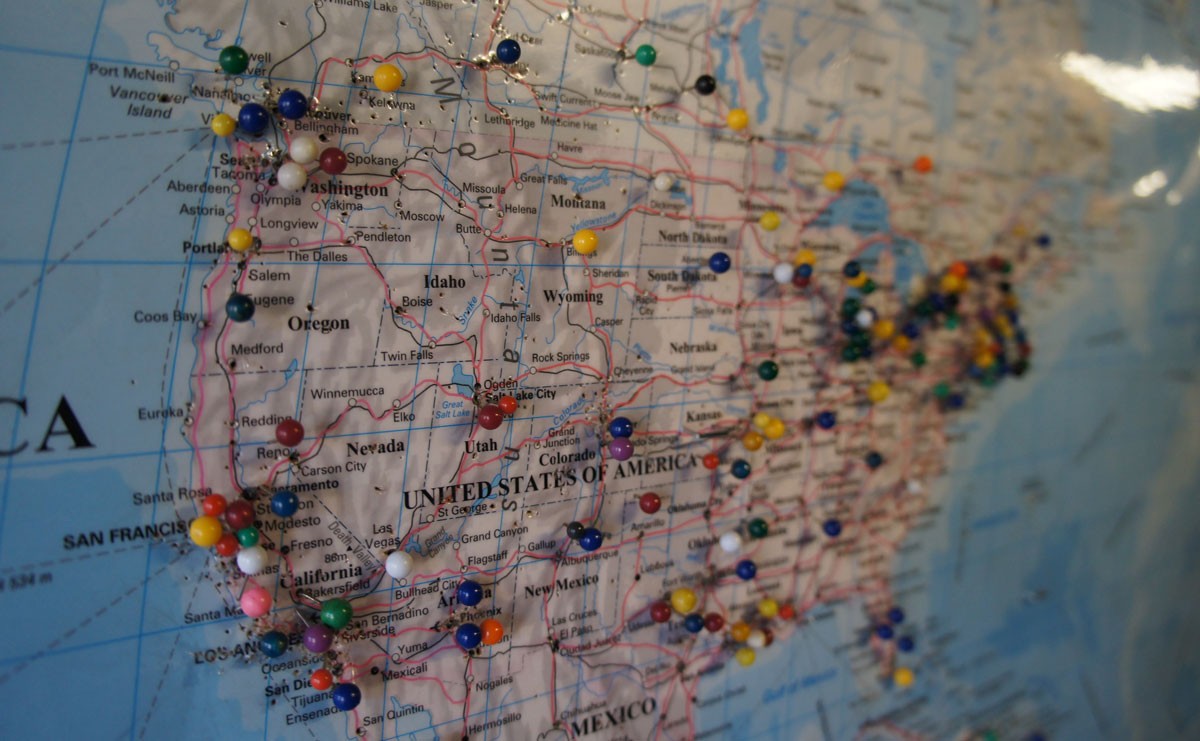 Photo of map of USA with pins in different locations