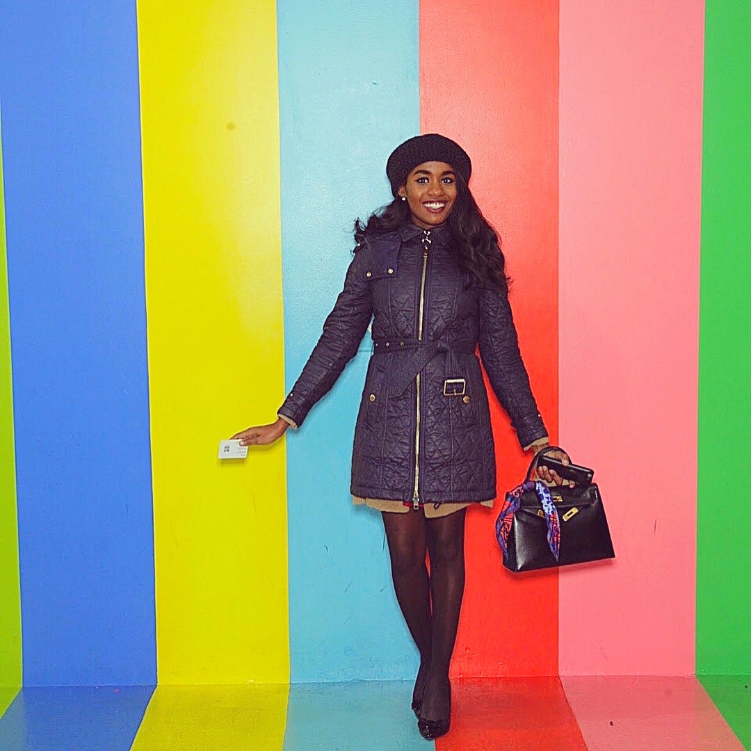 image-of-christine-in-front-of-a-colorful-striped-wall