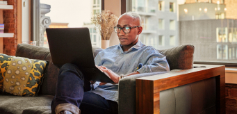 photo of a person working on a laptop