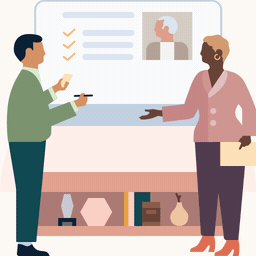 Image de deux professionnels discutant du profil d’un employé