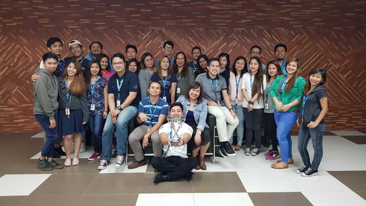Arvato purchased Lynda.com, an eLearning provider, and masterfully made it part of their culture. Here's their Philippines branch with the learning trophy.