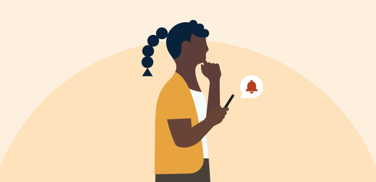 Illustration of a person receiving an account alert on their phone.